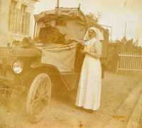 Annie Brewer and ambulance Annie Brewer beside an ambulance possibly driven by Daniel Mistrick